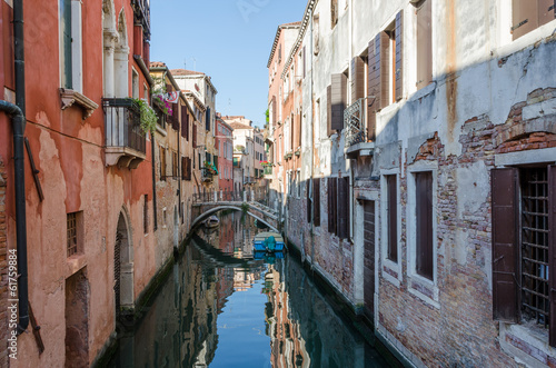 Small bridge between bulidings in Venice © gordand