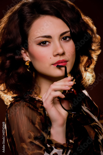 young woman with makeupwoman with makeup in glasses photo