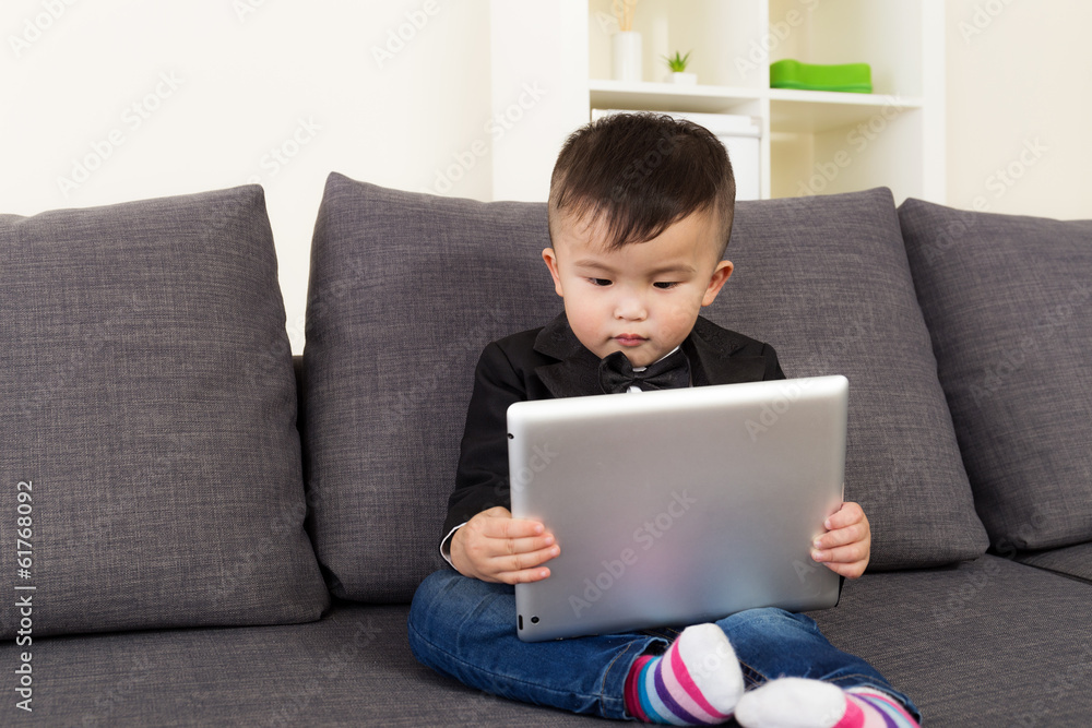 Asian little boy using tablet Asian little boy using tablet