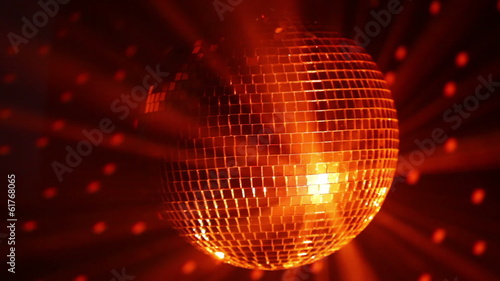 Orange disco ball and reflected dots on the wall, loop-ready