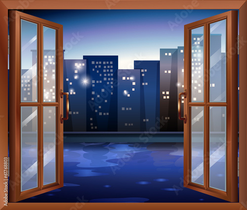 A window across the tall city buildings