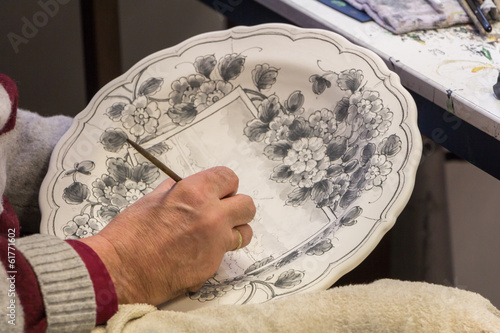 Painting of a traditional Delft blue plate photo