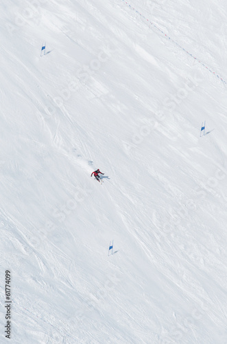 Skiers going down the slope at ski resort