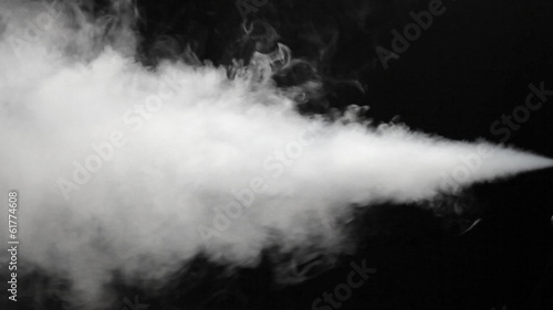 High pressure of white smoke blowing out on black background
