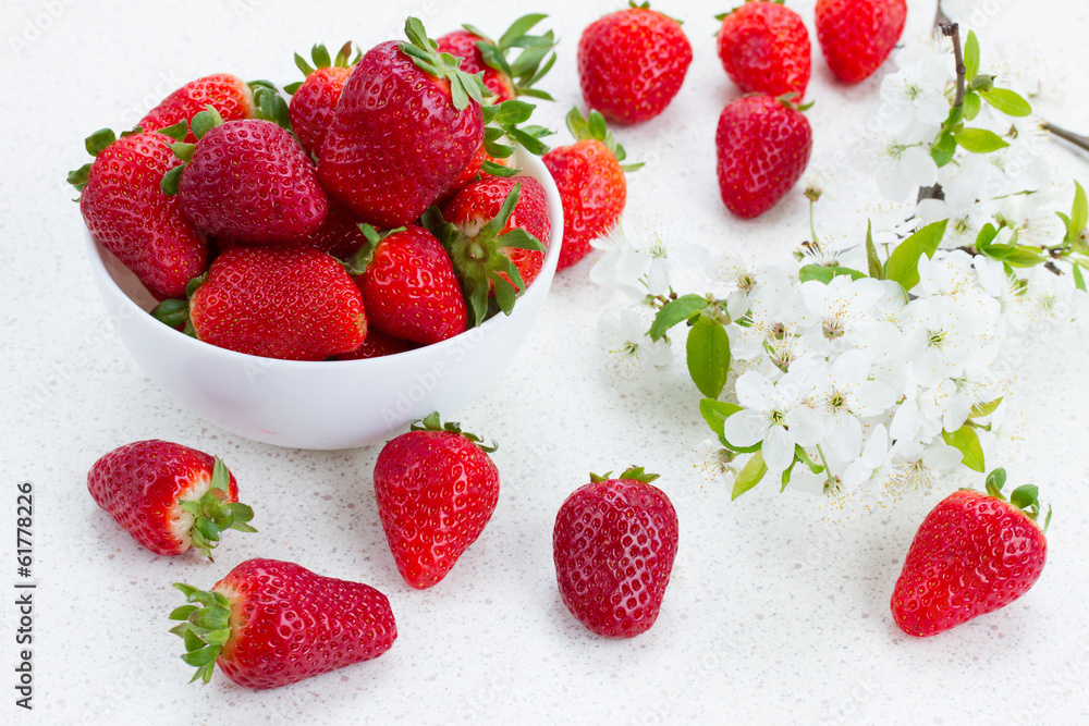 Plate of strawberries with spring twigs Plate of strawberries with spring twigs
