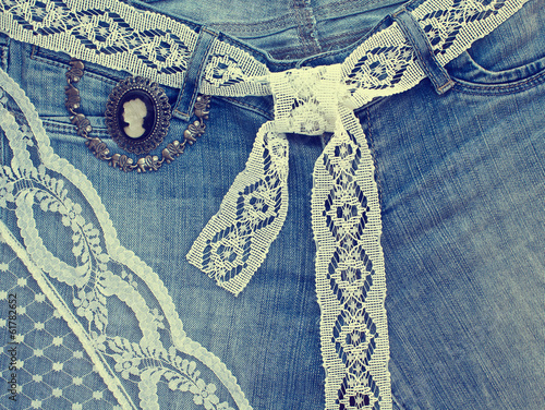 Denim background with lace and jewelry