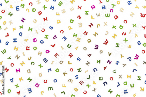 Many letters of various colors mixed