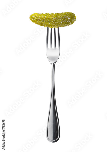 marinated pickled cucumber on a fork isolated on a white backgro