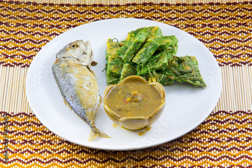 Fried Mackerel fish,chili sauce ,and fried vegetable photo