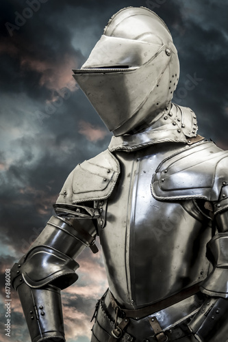 Safety.Medieval armor over clouds background. Concept of firewal