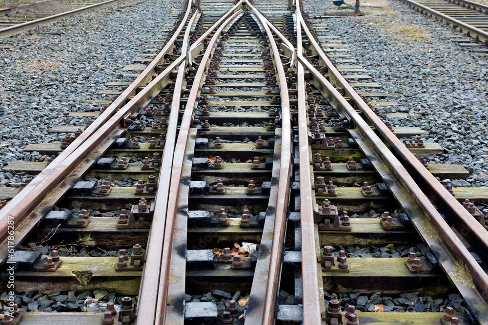 Fototapeta premium Railroad crossing on a gravel