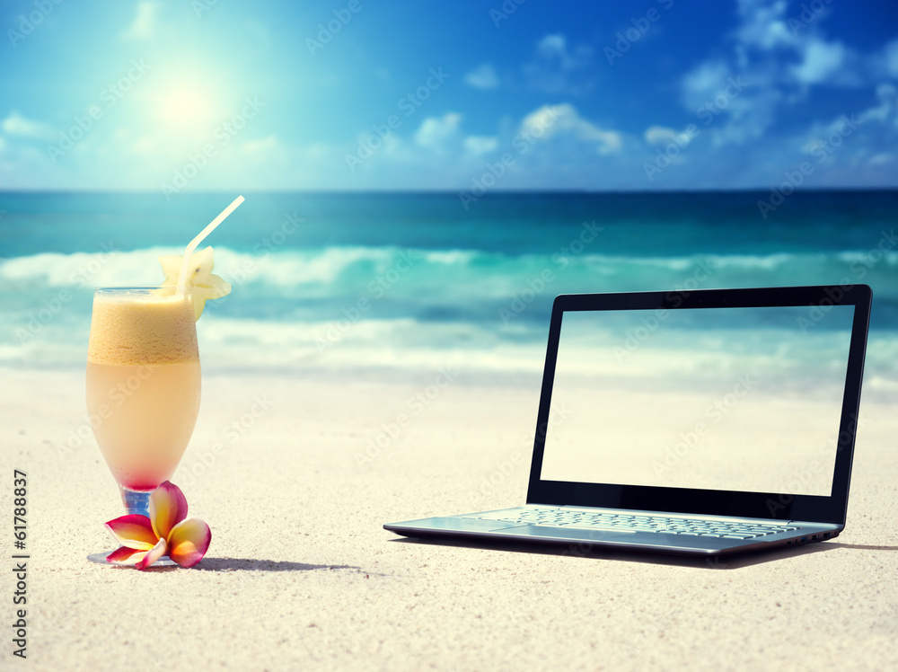 notebook on the beach and glass of fresh jucie notebook on the beach and glass of fresh jucie