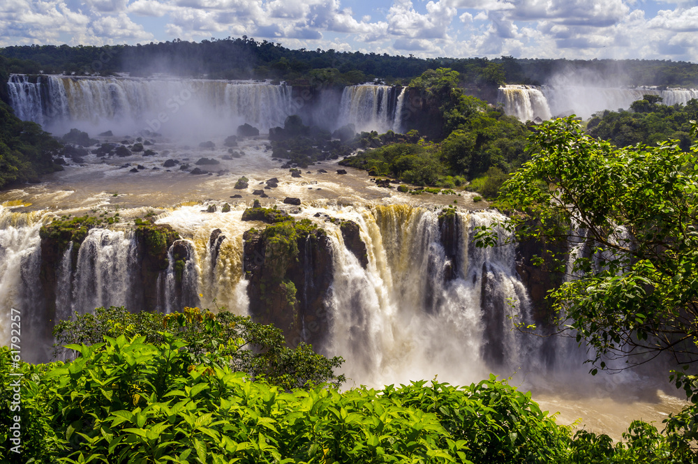 Beautiful cascade of waterfalls. Iguassu falls in Brazil with ri Beautiful cascade of waterfalls. Iguassu falls in Brazil with ri