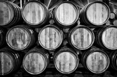 Obraz na plátně Whisky or wine barrels in black and white