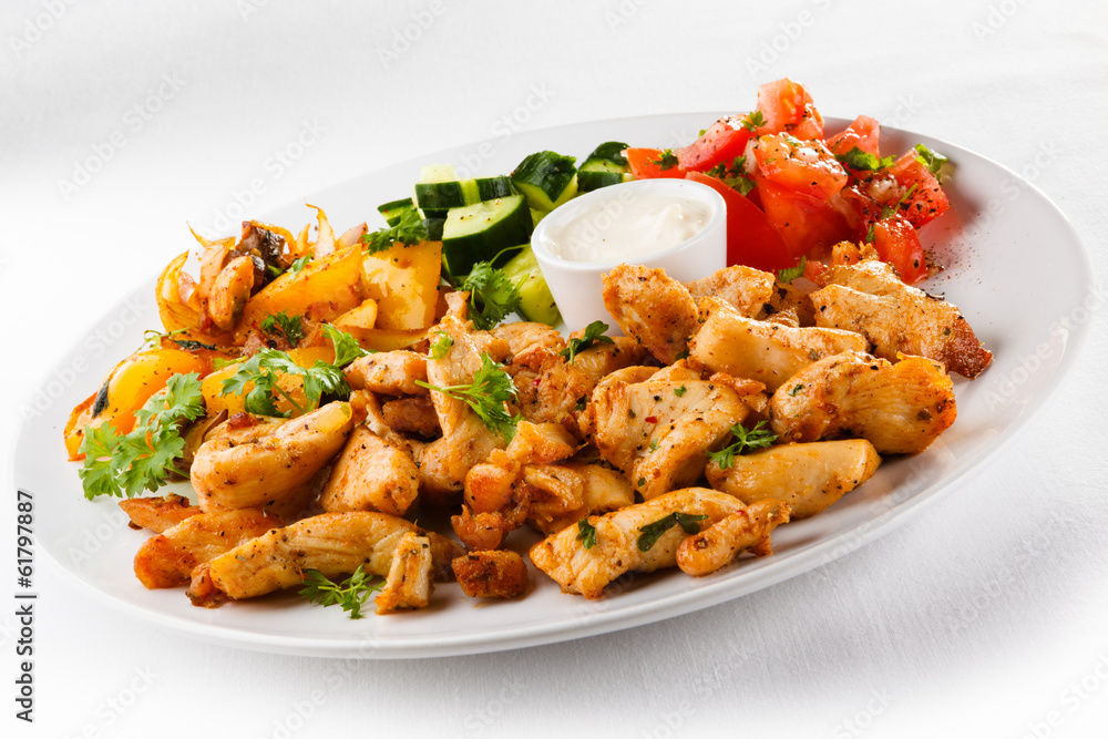 Grilled meat and vegetables on white background Grilled meat and vegetables on white background