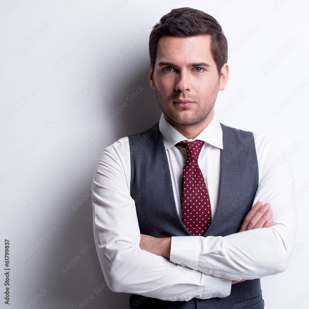 Portrait of young businessman in gray suit. Portrait of young businessman in gray suit.
