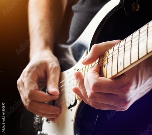 Man playing guitar. Close-up view