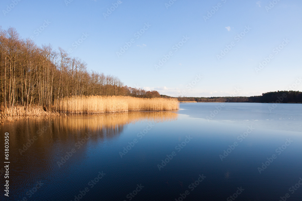 Lake in Poland slightly frozen in winter Lake in Poland slightly frozen in winter