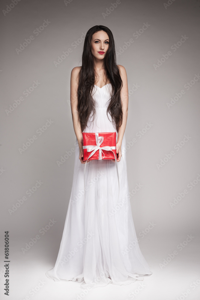Gorgeous woman holding gift