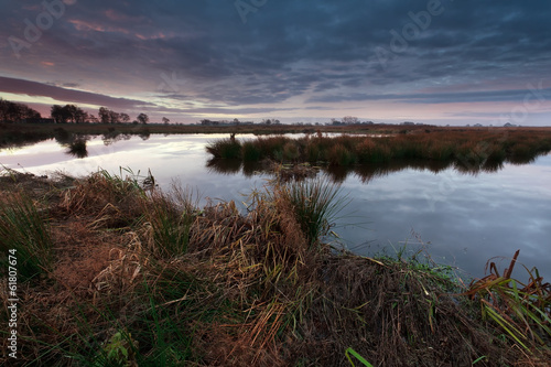 sunrise over swamp in autumn