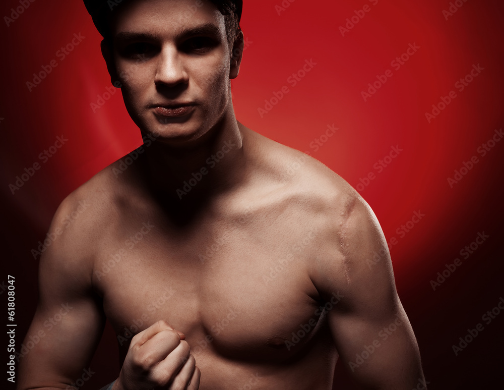 Fototapeta premium Muscular man portrait in the studio
