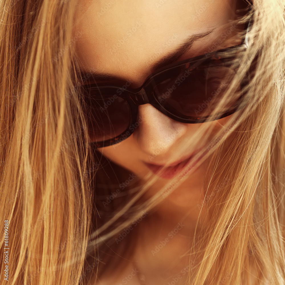 Beautiful fashionable portrait of a close-up girl in glasses Beautiful fashionable portrait of a close-up girl in glasses