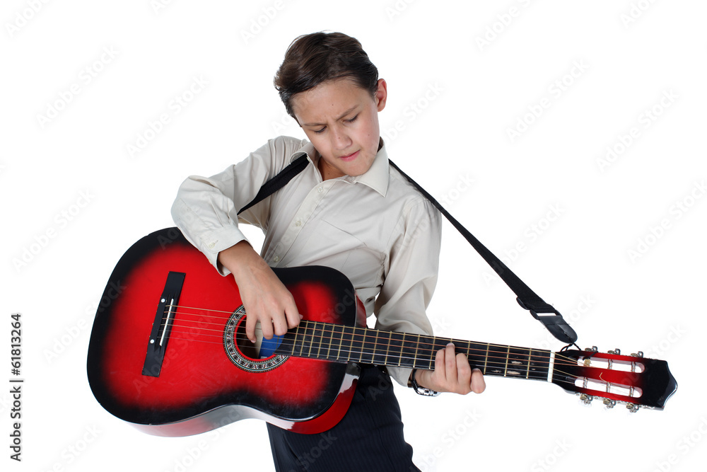 young guitar player performing very passionately on a white back young guitar player performing very passionately on a white back