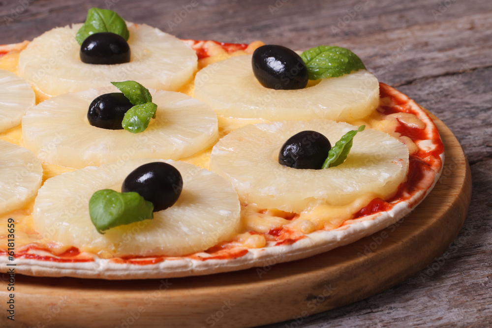 Pizza with pineapple, black olives and green basil Pizza with pineapple, black olives and green basil