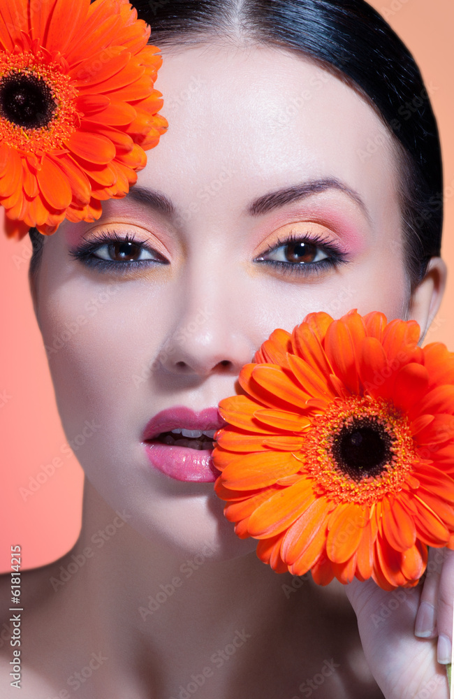 beautiful woman with stylish make-up and bright flowers beautiful woman with stylish make-up and bright flowers