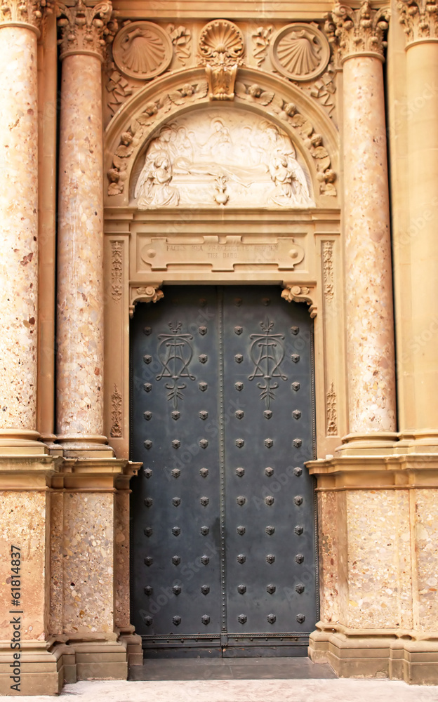 Door of Santa Maria de Montserrat Abbey in Barcelona, Spain