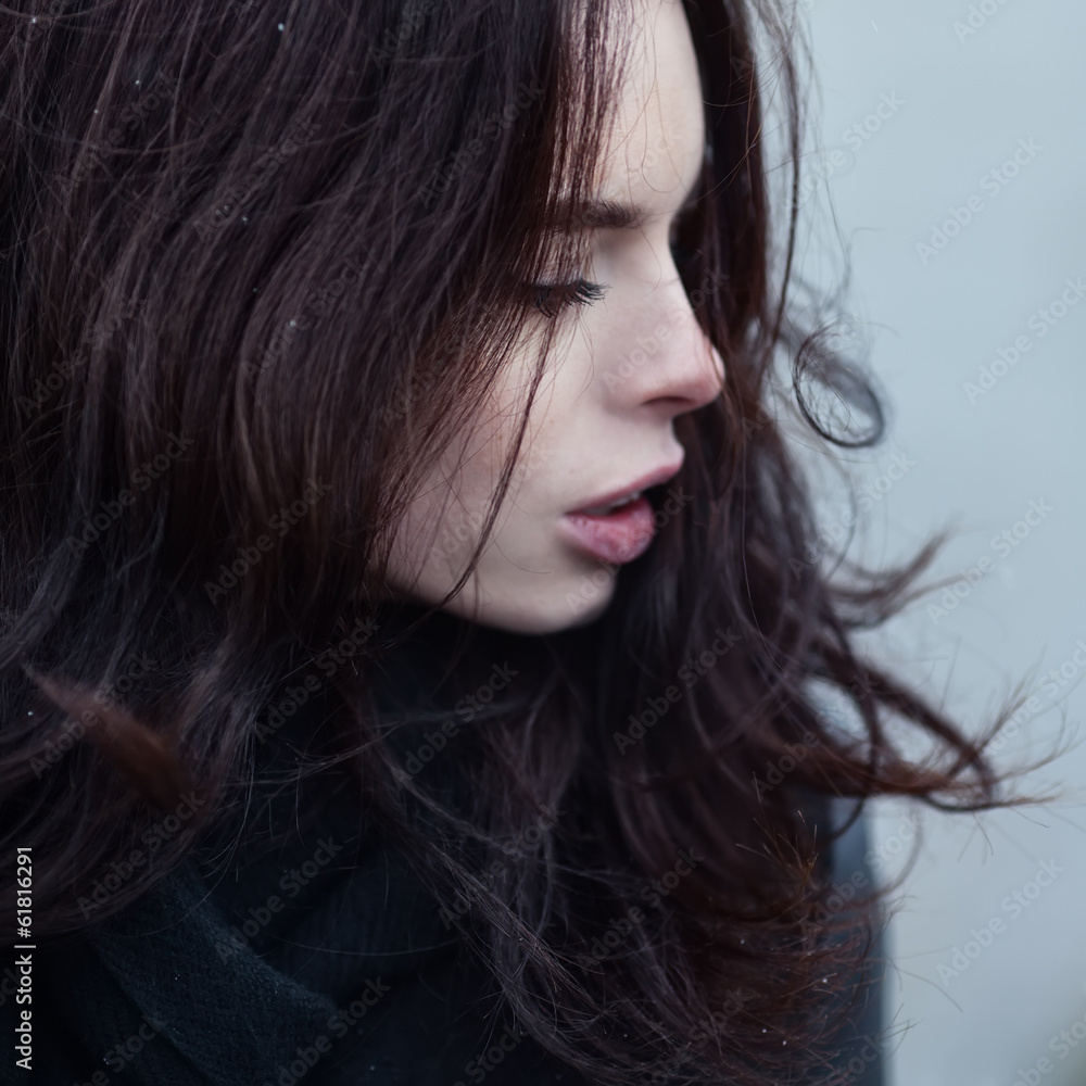 Close portrait of a beautiful sexy girl in the wind