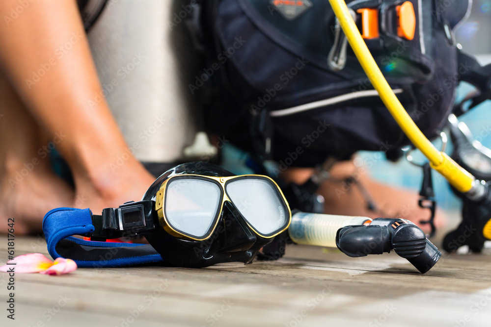 Naklejka premium divemaster and students at the diver Course on holiday wearing a