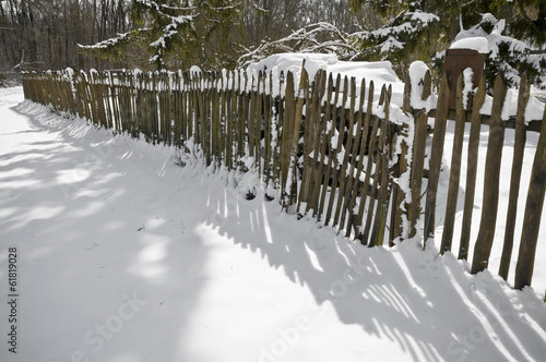 Old fence with snow