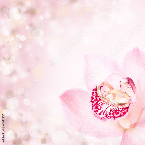 Fototapeta Naklejka Na Ścianę i Meble -  Pink orchid and wedding rings