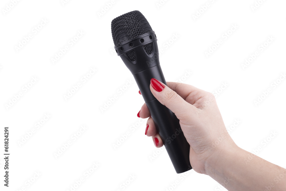 Obraz premium Female hand with a microphone.