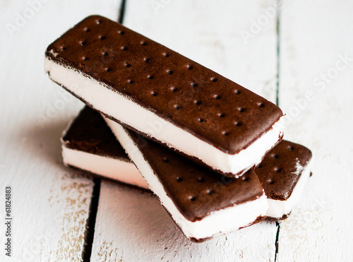 Ice cream sandwiches on wooden background