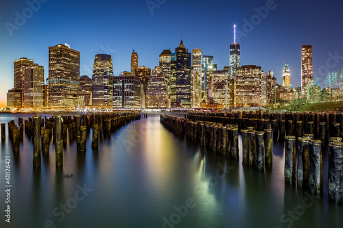 Lower Manhattan and an old Brooklyn pier at dusk