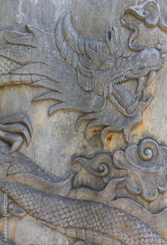 Oriental wooden dragon carving © singkamc