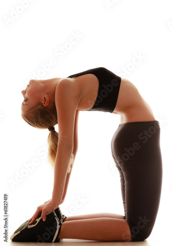 Fototapeta Naklejka Na Ścianę i Meble -  Full length sport woman doing stretching exercise isolated