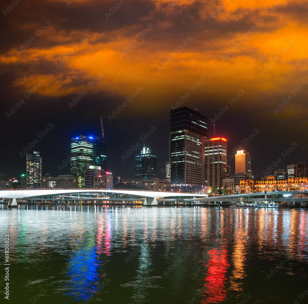 Fototapeta premium Brisbane skyline at night with river reflections