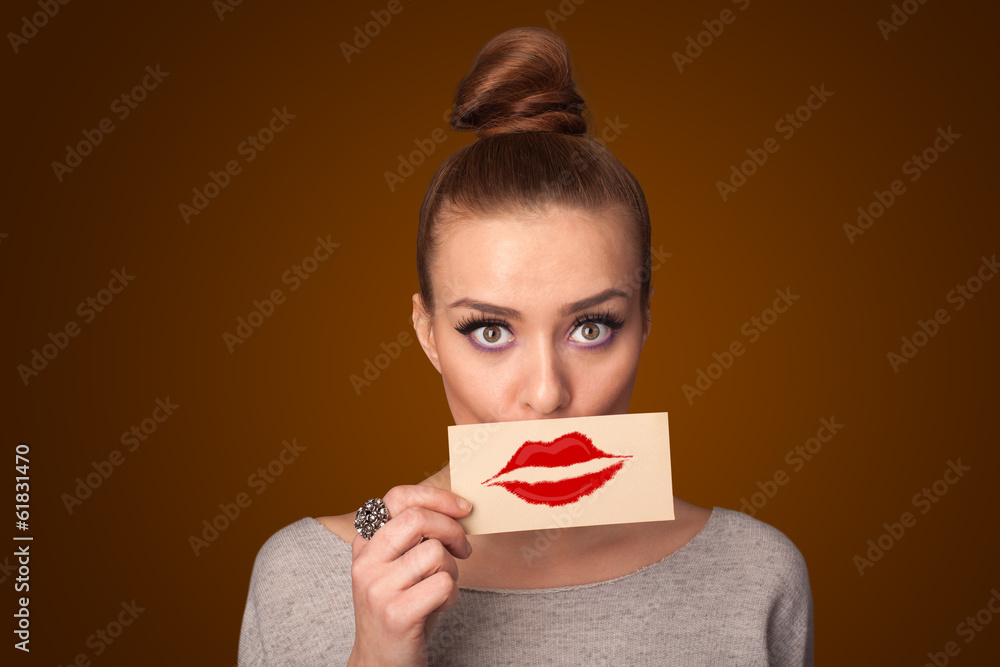 Happy pretty woman holding card with kiss lipstick mark Happy pretty woman holding card with kiss lipstick mark