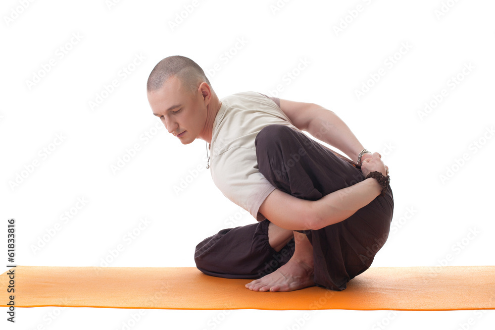 Shot of handsome middle aged yogi posing in studio