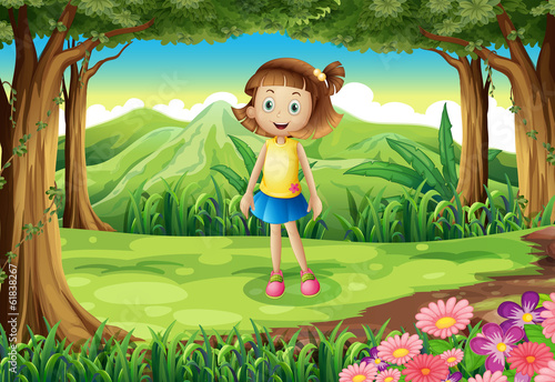 A smiling little girl at the forest