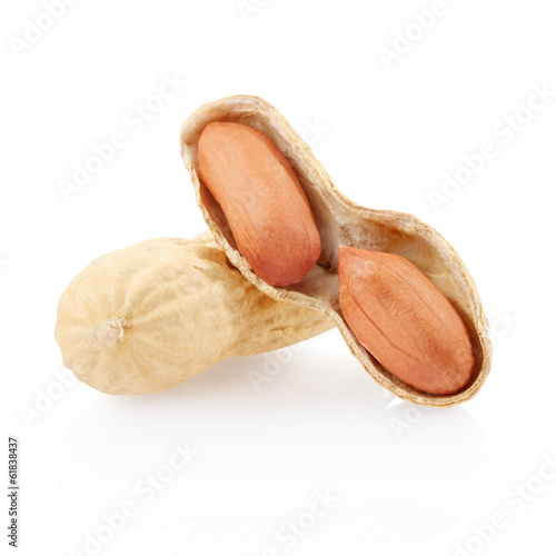 Dried peanuts open on white, clipping path