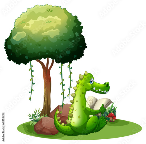 A crocodile reading beside the tree