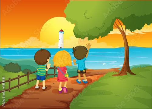 Three kids watching the lighthouse