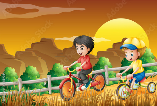 Kids biking at the woods