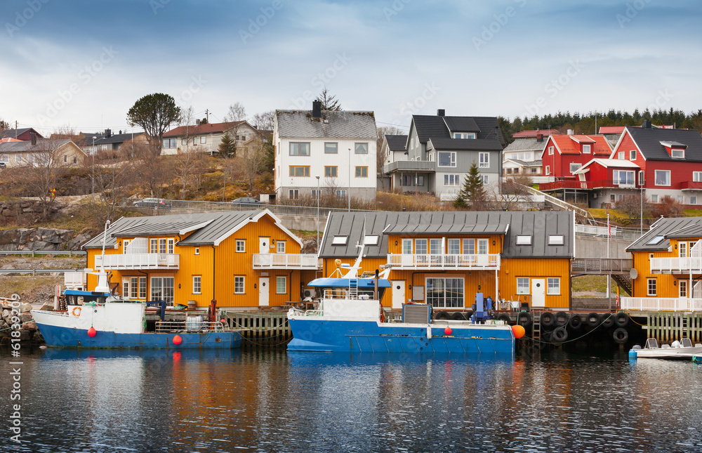 Norwegian fishing village with wooden houses on the coast