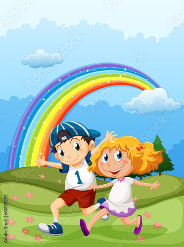 A boy and a girl running with a rainbow in the sky