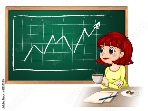A woman taking a break in front of the blackboard